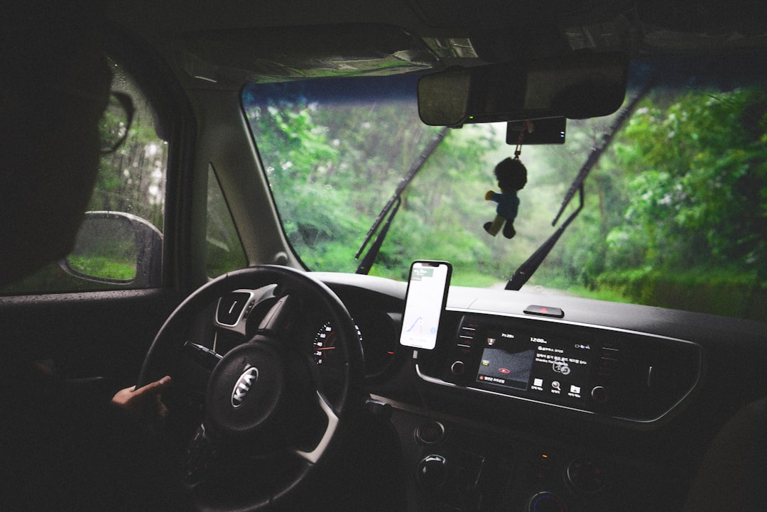 the dashboard of a car with a cell phone in it