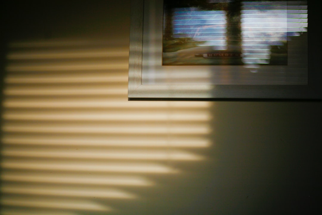 A blurry picture of a window and a wall